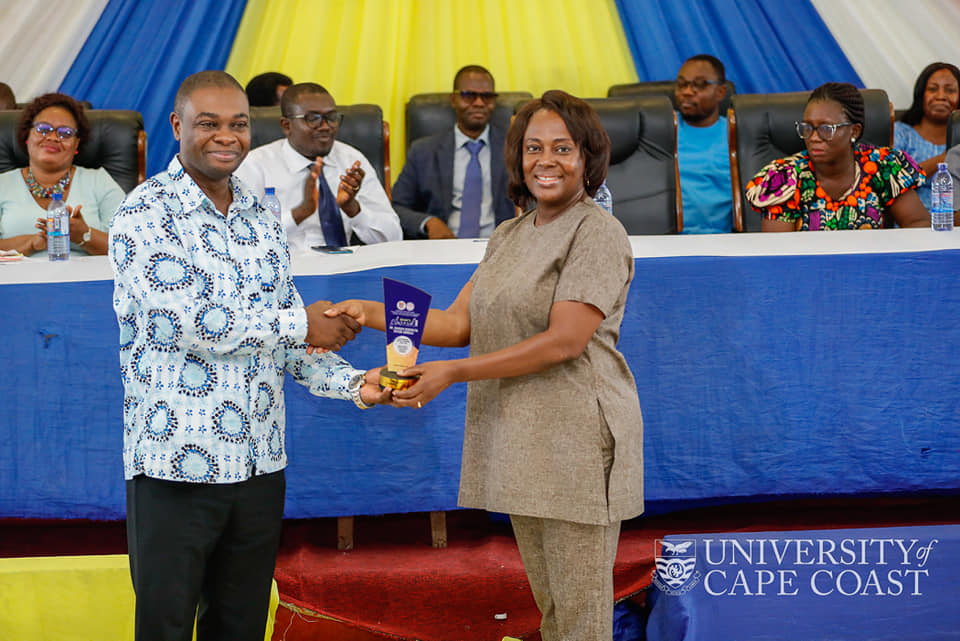 Prof. Desmond Omane Acheampong honouring Dr. Hannah Benedicta Taylor-Abdulai from the department of Physician Assistant Studies.